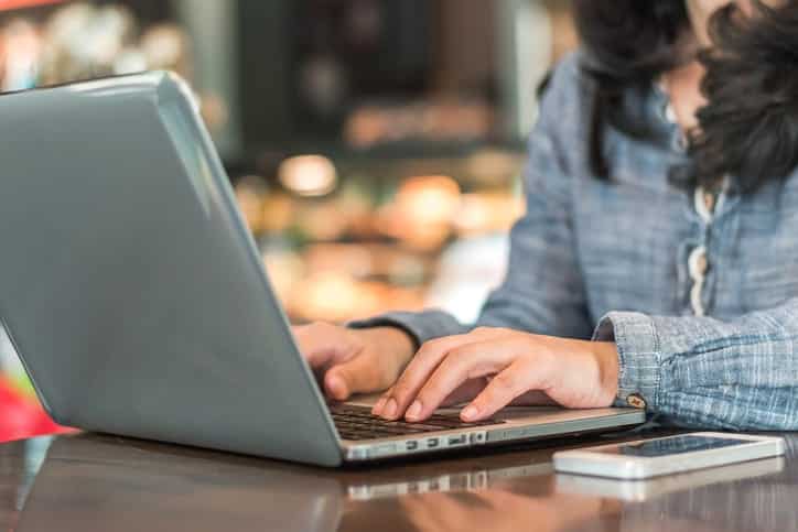 Digital lifestyle blog writer or business person using smart device working on internet communication technology
