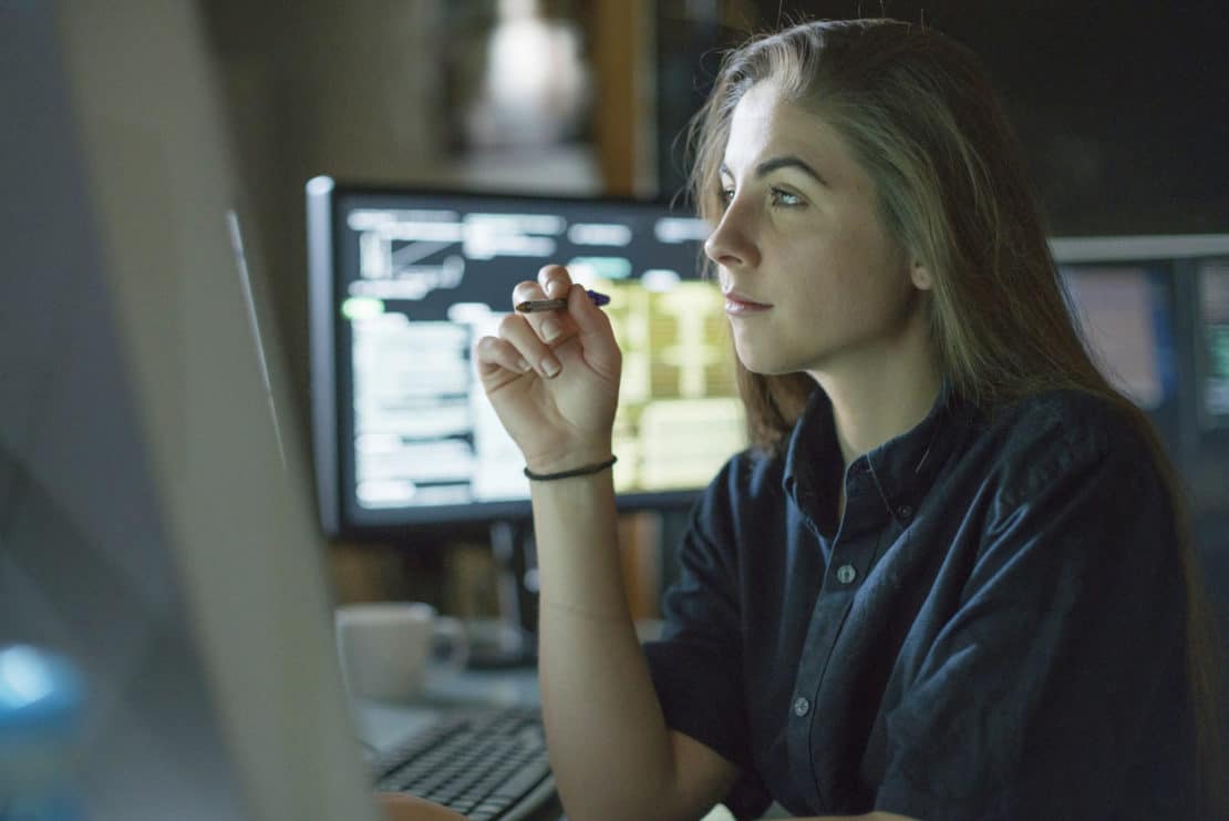 woman analysing data on computer