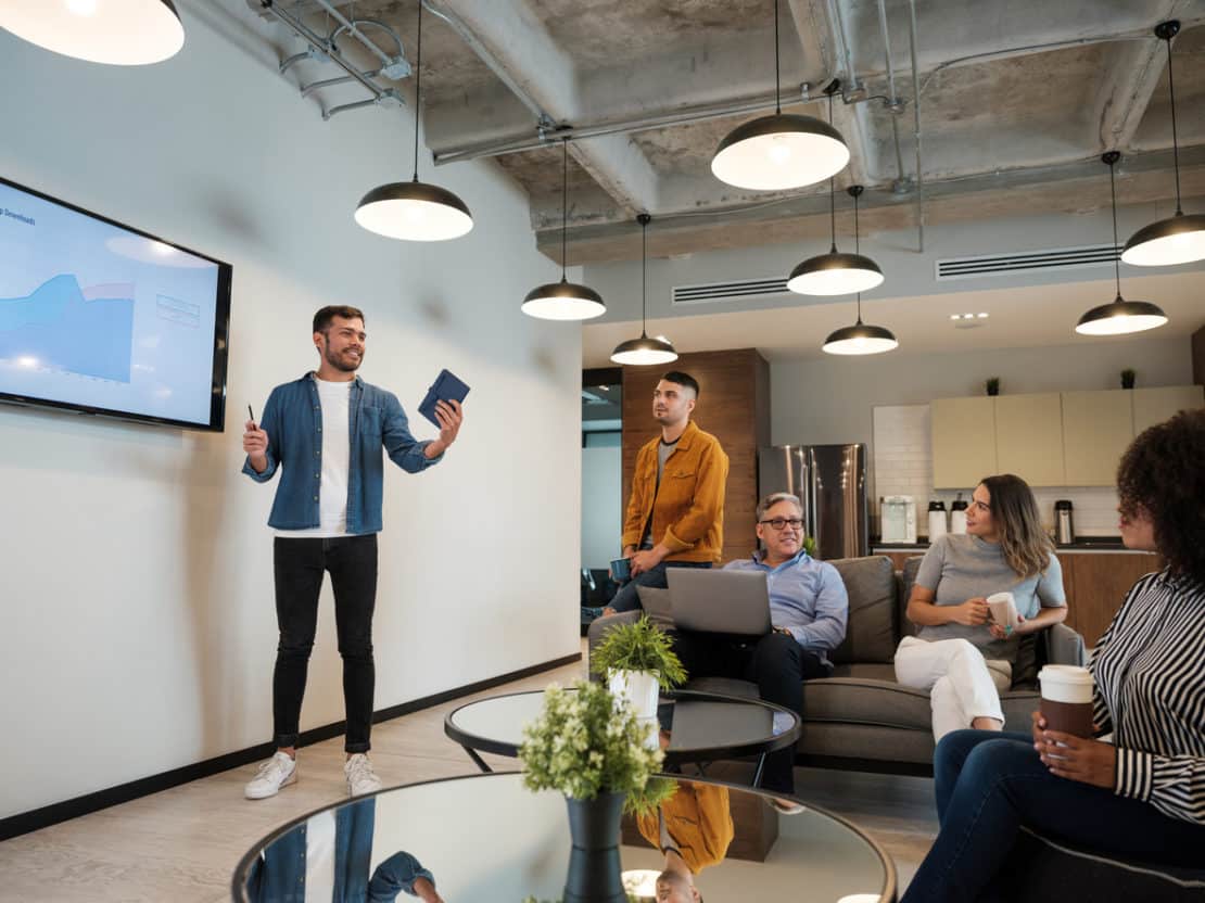 man pitching idea to his team