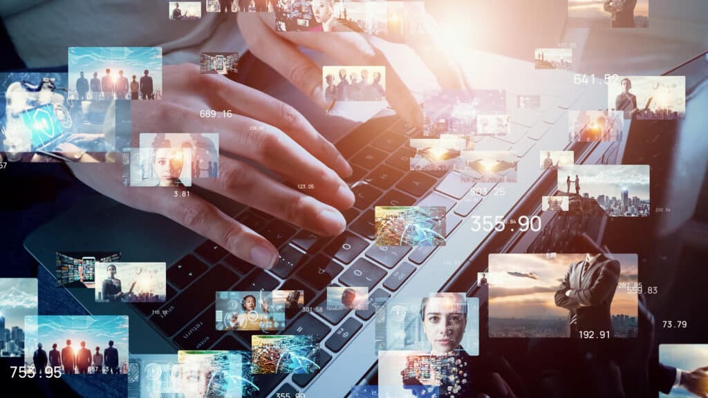 Collage of business related photos in front of hands typing on a laptop