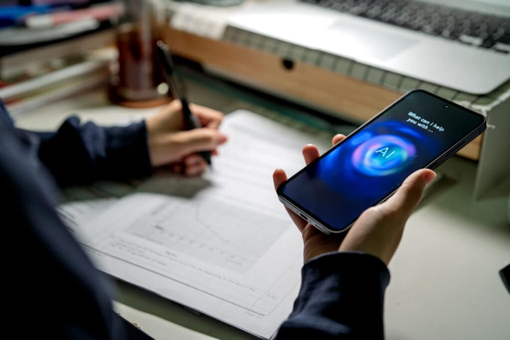 student using chatbot on phone to help work